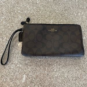 Coach pebbled brown leather wristlet with signature logo design